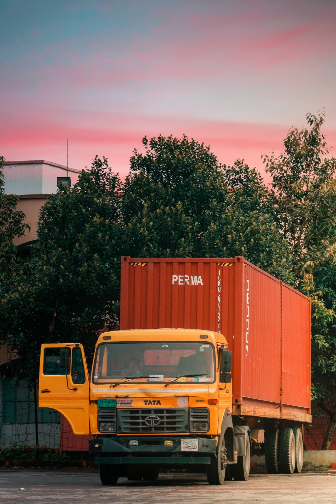 Yellow Tata freight truck parked at the Montiva road logistics yard